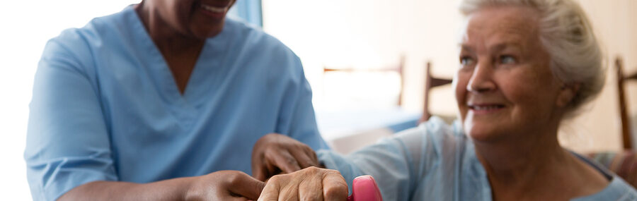 bigstock Nurse helping senior woman in 201165016